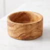 Empty olive wood snack bowl on white marble
