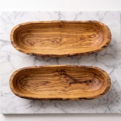 Top view of two empty olive wood bowls
