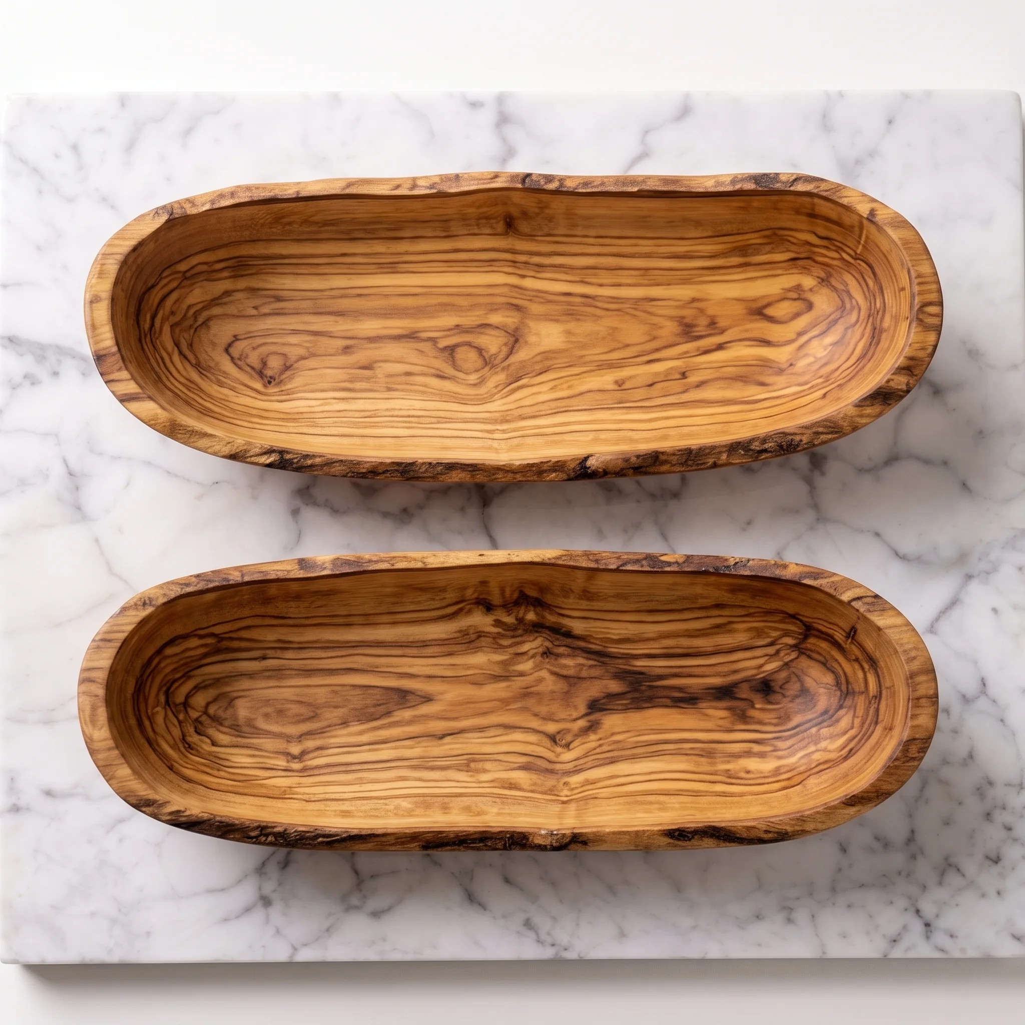 Top view of two empty olive wood bowls