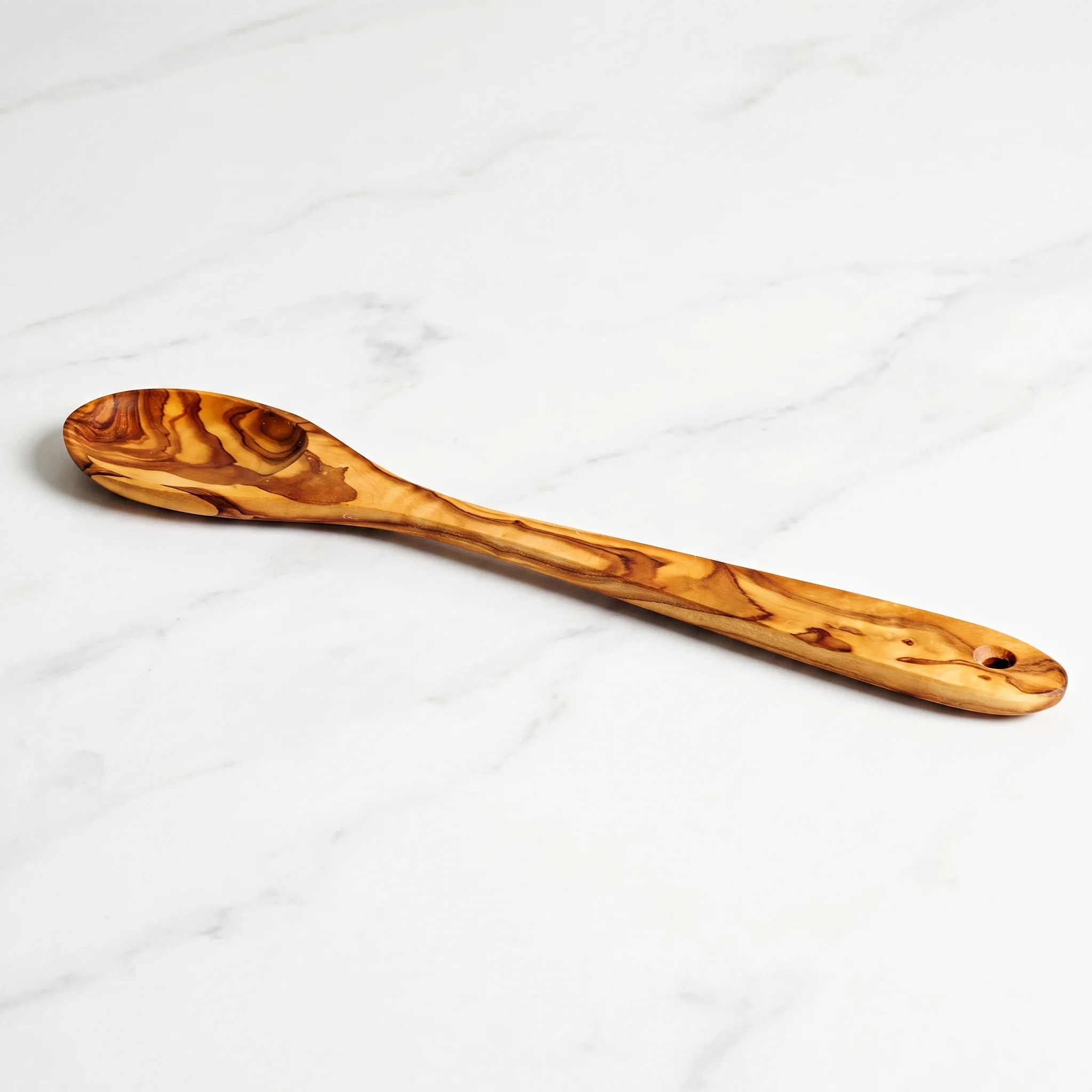 30 cm olive wood spoon on white marble