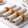 Four cloth napkins with olive wood napkin rings